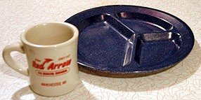 a blue divided plate and a mug